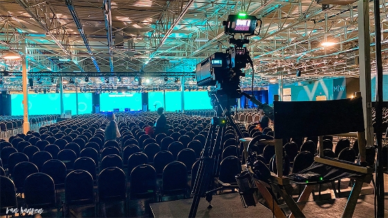 Video camera at back of auditorium BTS after the Trevor Keynote