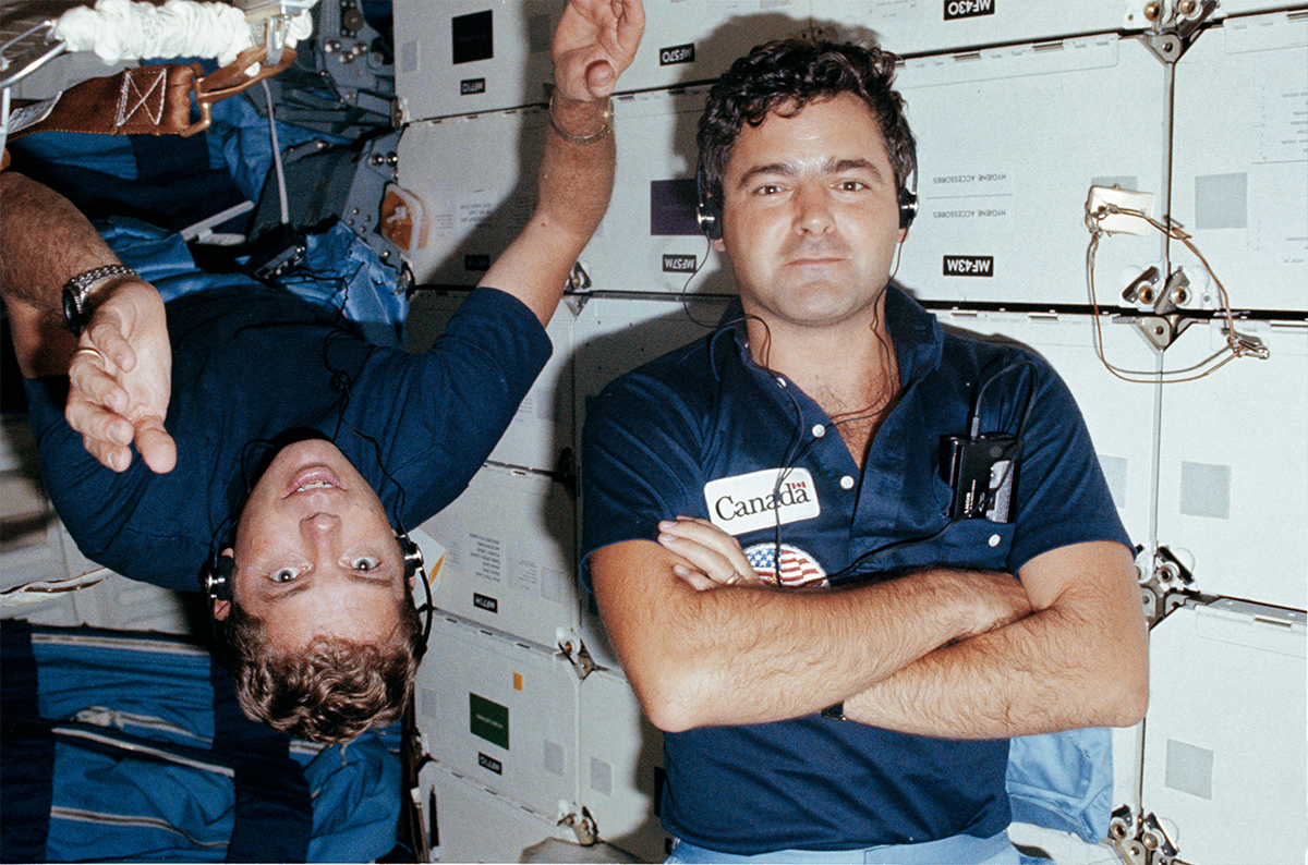 Marc Garneau, Payload Specialist conducting an NRC test with David Leestma, Mission Specialist observing (NASA)